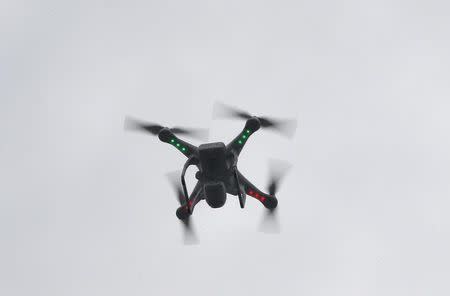 A camera drone flown by Brian Wilson flies near the scene where two buildings were destroyed in an explosion, in the East Harlem section in New York City, March 12, 2014. REUTERS/Mike Segar