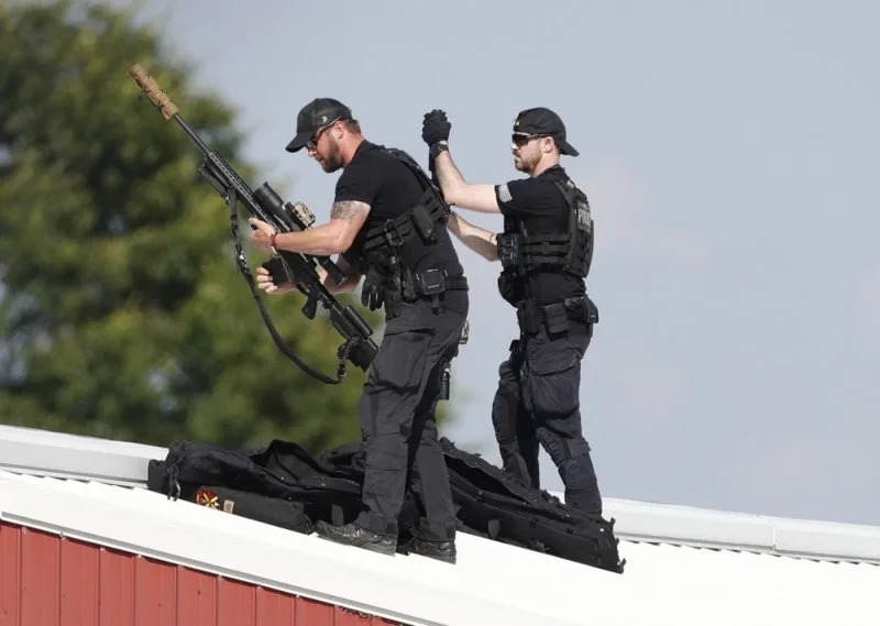 Law enforcement snipers set up before the arrival of former president Trump on a rooftop overlooking a campaign rally at the Butler Farm Show Inc. in Butler, Pa., on Saturday. Photo by David Maxwell/EPA-EFE