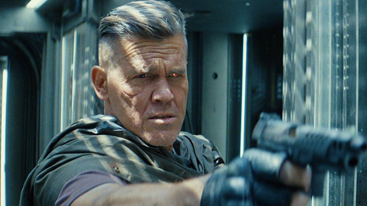  Josh Brolin pointing a gun as Cable in Deadpool 2. 