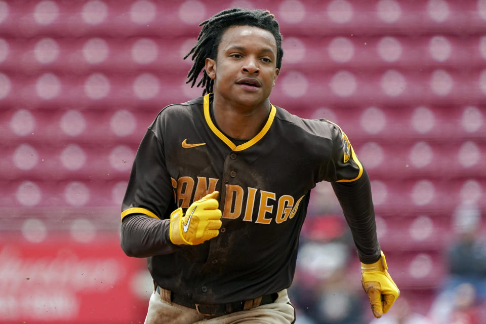 San Diego Padres' C.J. Abrams advances to third base on a throwing error by Cincinnati Reds starting pitcher Tyler Mahle during the second inning of a baseball game, Thursday, April 28, 2022, in Cincinnati. (AP Photo/Jeff Dean)