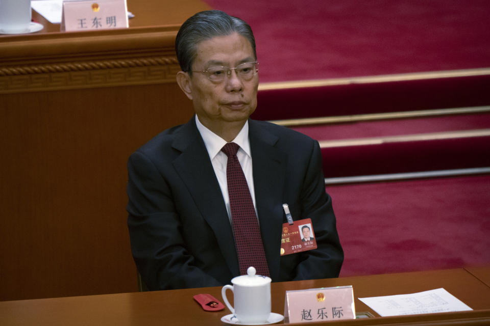 Zhao Leji attends a session of China's National People's Congress (NPC) at the Great Hall of the People in Beijing, Friday, March 10, 2023. Six men sit alongside Chinese leader Xi Jinping on the ruling Communist Party's all-powerful Politburo Standing Committee, handling major portfolios from propaganda to corruption fighting. (AP Photo/Mark Schiefelbein)