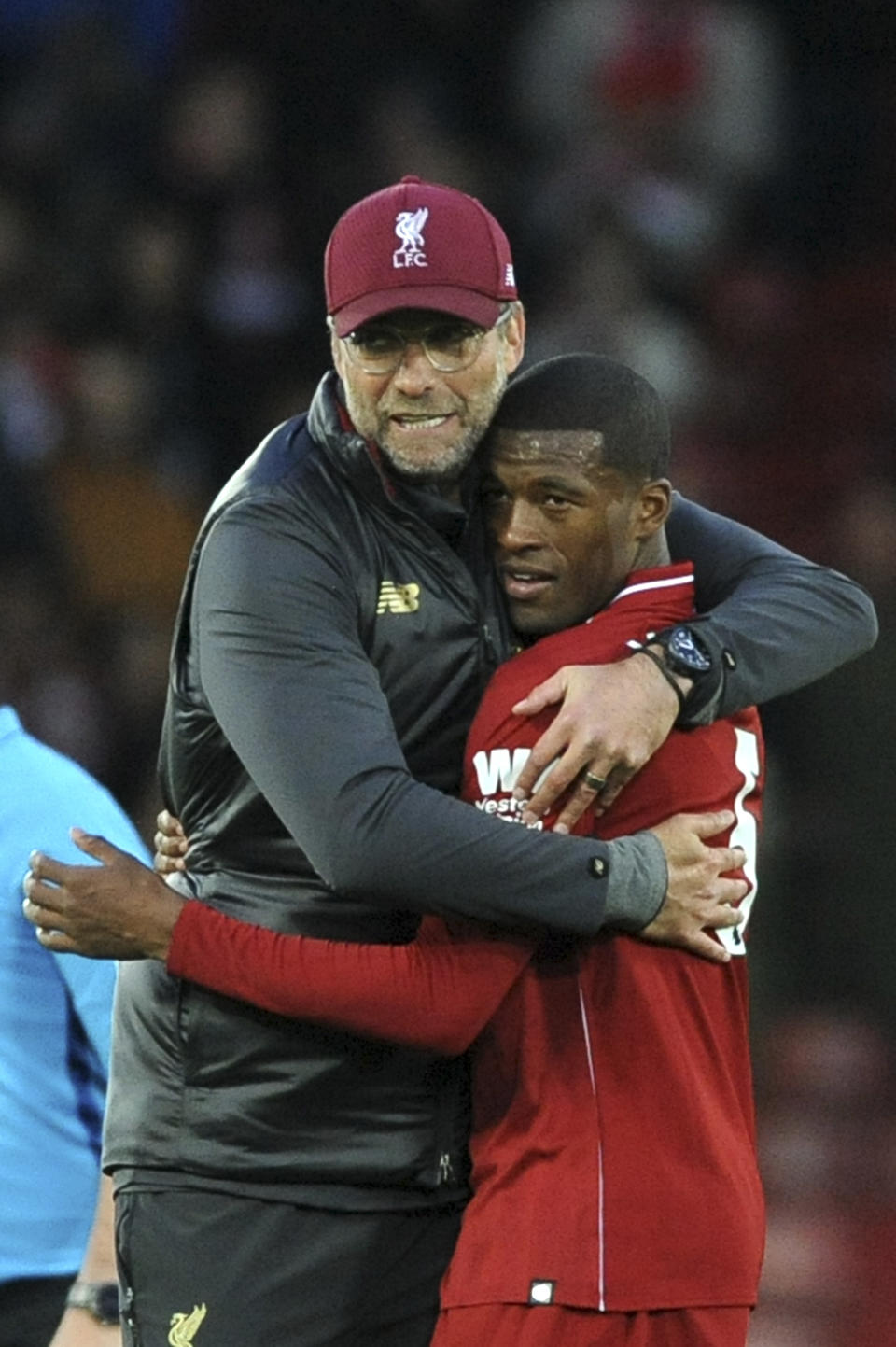 Liverpool manager Juergen Klopp hugs Liverpool's Georginio Wijnaldum after the English Premier League soccer match between Liverpool and Manchester City at Anfield stadium in Liverpool, England, Sunday, Oct. 7, 2018. (AP Photo/Rui Vieira)