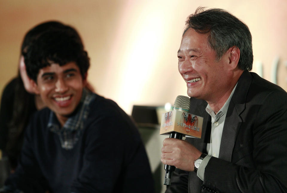 Lead actor from India Suraj Sharma, left, looks on, as Taiwanese director Ang Lee answers questions during a press conference announcing their new film "Life of Pi," in Taipei, Taiwan, Wednesday, Nov. 7, 2012. "Life of Pi" is an upcoming 3D adventure film based on the 2001 novel of the same name by Yann Martel, staring Sharma and directed by Lee. (AP Photo/Wally Santana)