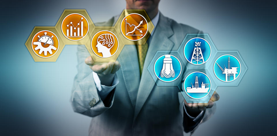 A man in a suit holding icons representing oil drilling and data.