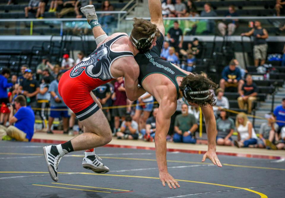 Coventry's Christian Rutherford attempts some-take down points during his semifinal match with Nicholas Baccala from Ponaganset.