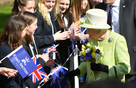 Queen Elizabeth II meets pupils during a visit to King's Bruton School where she will mark the School's 500th anniversary and open the new Music Centre, in Bruton, Somerset, Britain March 28, 2019. Ben Birchall/Pool via REUTERS