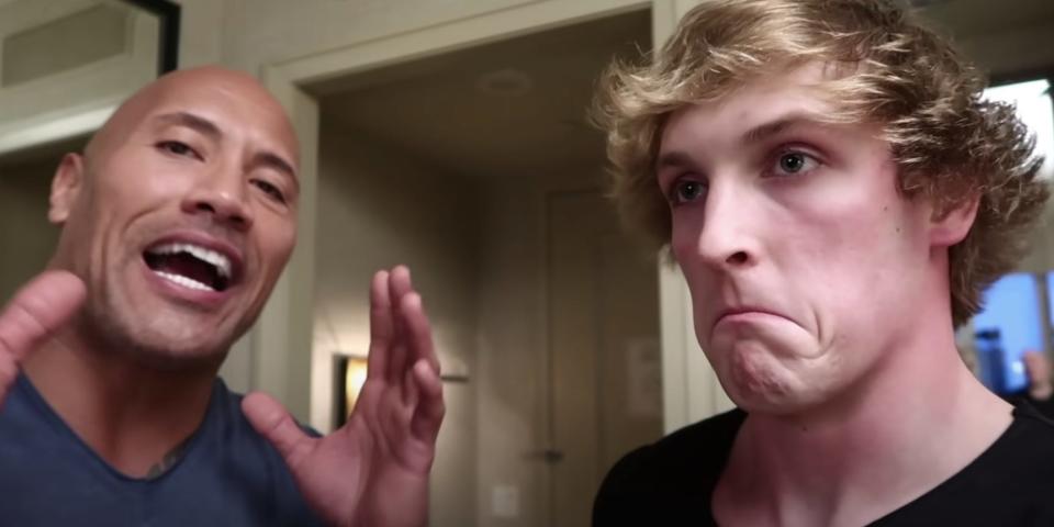 A picture of Logan Paul and the Rock talking