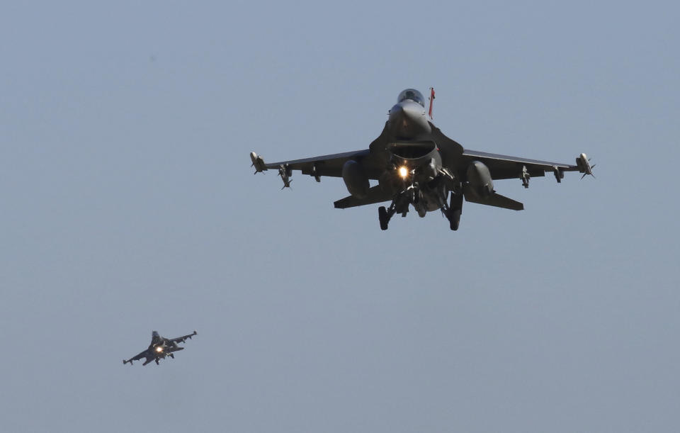 FILE - U.S. Air Force F-16 fighter jets fly over the Osan U.S. Air Base during a combined air force exercise with the United States and South Korea in Pyeongtaek, South Korea, Dec. 4, 2017. The U.S. has once again buckled under pressure from European allies and Ukraine's leaders and agreed to provide more sophisticated weapons to the war effort. This time it's all about F-16 fighter jets. (AP Photo/Ahn Young-joon, File)