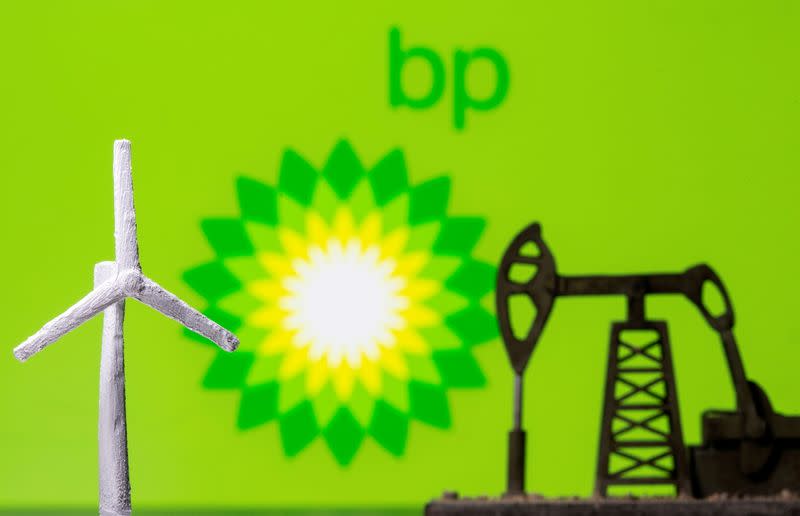 FILE PHOTO: A 3D printed windmill and oil pump jack are seen in front of displayed BP (British Petroleum) logo in this illustration picture