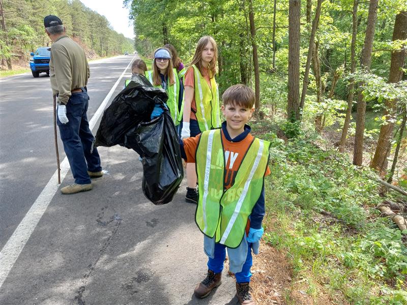 Volunteers help during an Earth Day cleanup event last year.