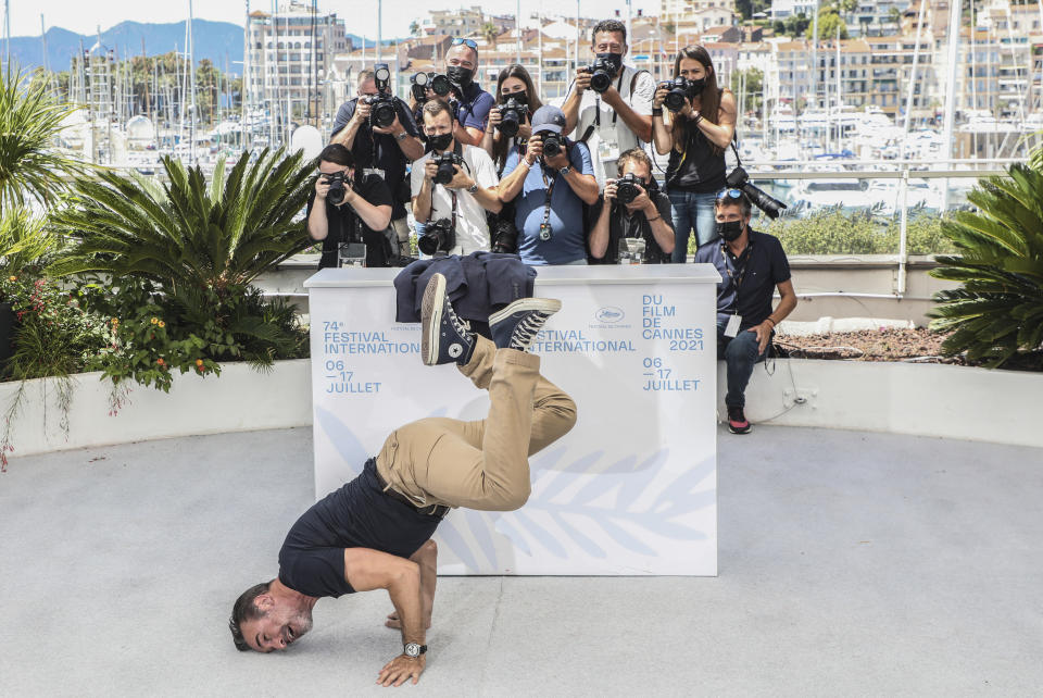 FILE - In this July 17, 2021 file photo Jean Dujardin poses for photographers at the photo call for the film 'OSS 117: From Africa with Love' at the 74th international film festival, Cannes, southern France. (Photo by Vianney Le Caer/Invision/AP, File)