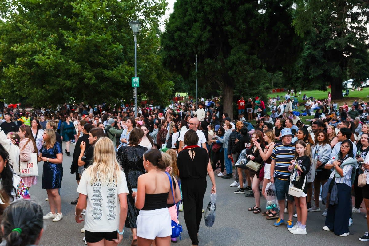 Taylor Swift fans with no tickets sing and dance during the concert outside the Melbourne Cricket Ground (Getty Images)