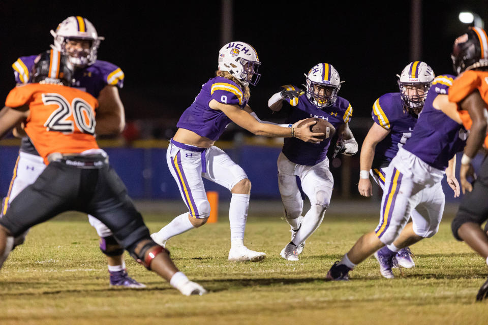 Union County quarterback A.J. Cortese (9) hands off to running back Rayvon Durant during an Oct. 14 game against Hawthorne.