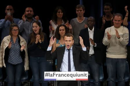 Former French economy minister Emmanuel Macron delivers a speech during a political rally for his political movement, En Marche !, or Forward !, in Montpellier, France, October 18, 2016. REUTERS/Jean-Paul Pelissier