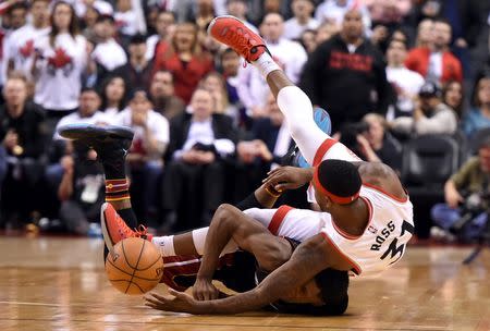 Miami Heat guard Josh Richardson (0) chases a loose ball with Toronto Raptors guard Terrence Ross (32) in game one of the second round of the NBA Playoffs at Air Canada Centre. Mandatory Credit: Dan Hamilton-USA TODAY Sports