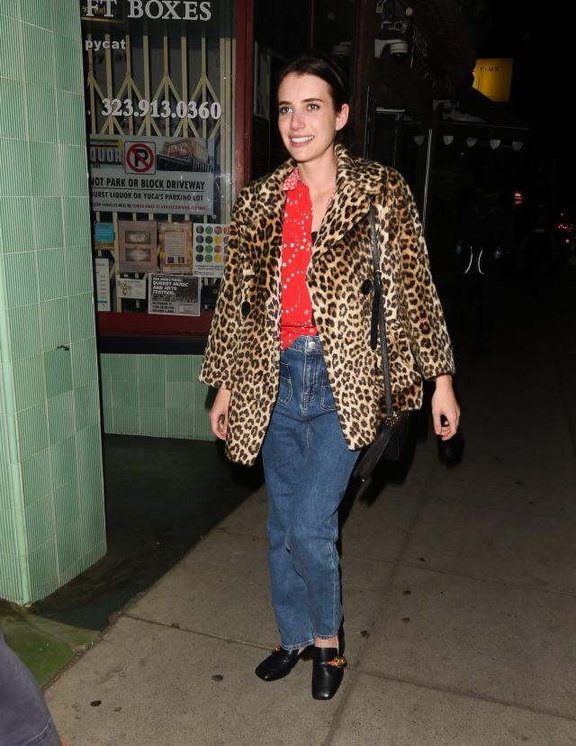 Emma Roberts bundles up in elaborate cheetah print coat with blush fur trim