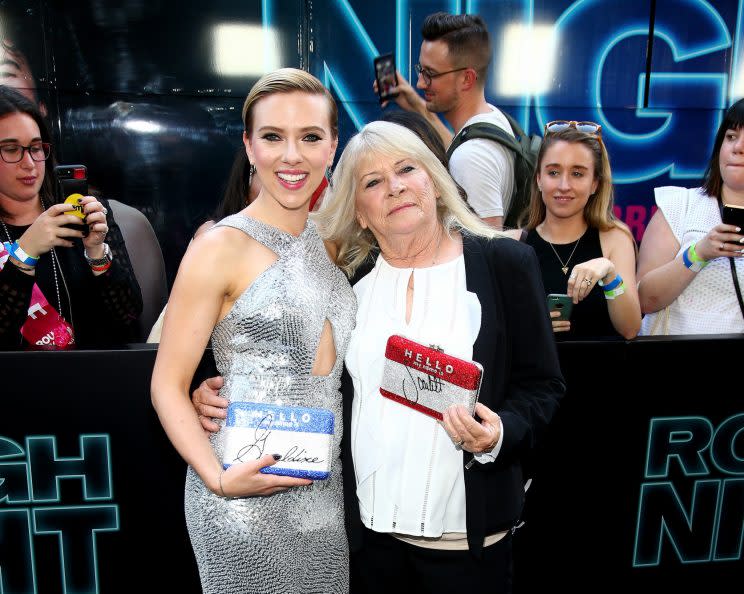 Scarlett Johansson and Geraldine Dodd, with their individualized clutches, at the premiere of Rough Night