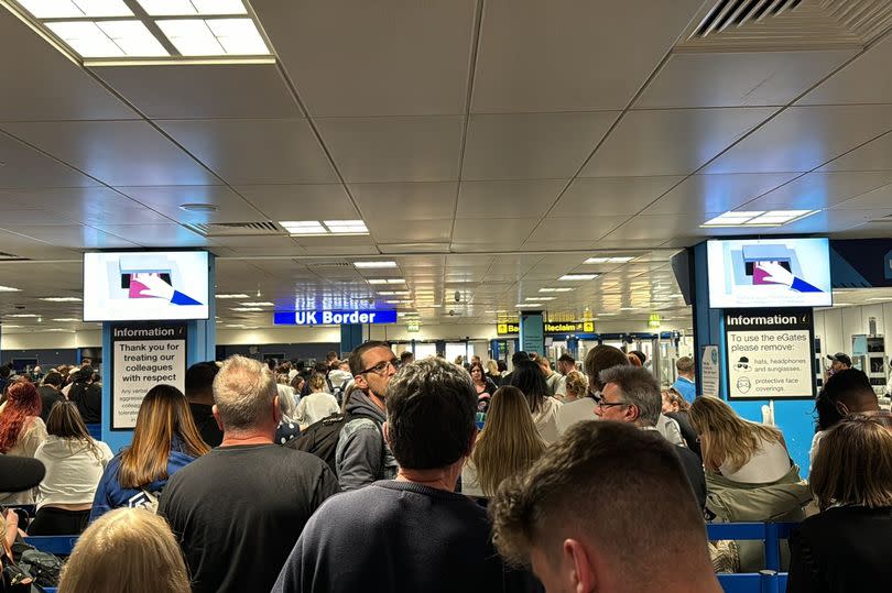 Queues at Manchester Airport amid the national outage