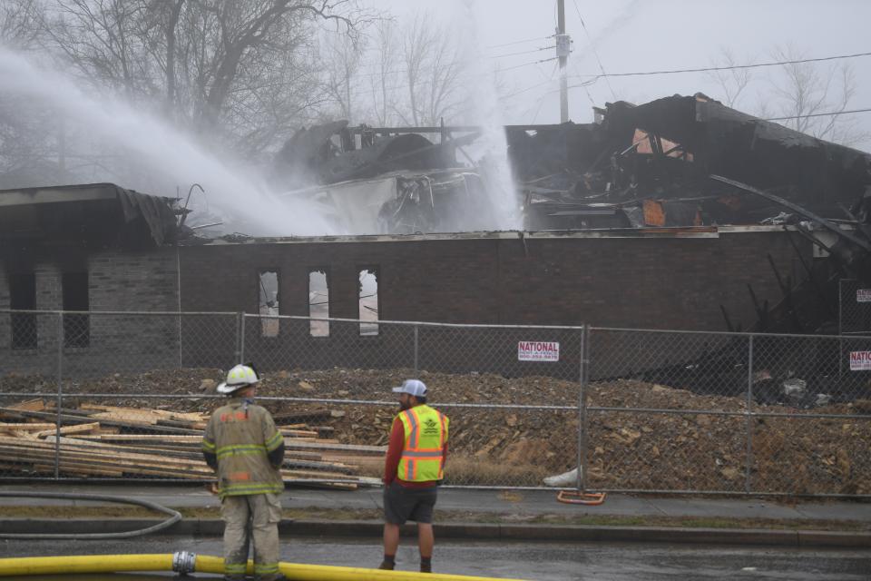 Firefighters work on putting out a fire in Knoxville’s Planned Parenthood building on Dec. 31.