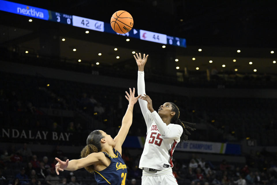 Washington State center Bella Murekatete (55) shoots against California forward Evelien Lutje Schipholt during the second half of an NCAA college basketball game in the first round of the Pac-12 women's tournament Wednesday, March 1, 2023, in Las Vegas. (AP Photo/David Becker)