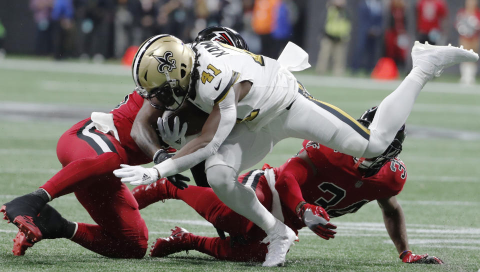 Atlanta Falcons middle linebacker Deion Jones (45) hits New Orleans Saints running back Alvin Kamara (41) on Thursday night. (AP)