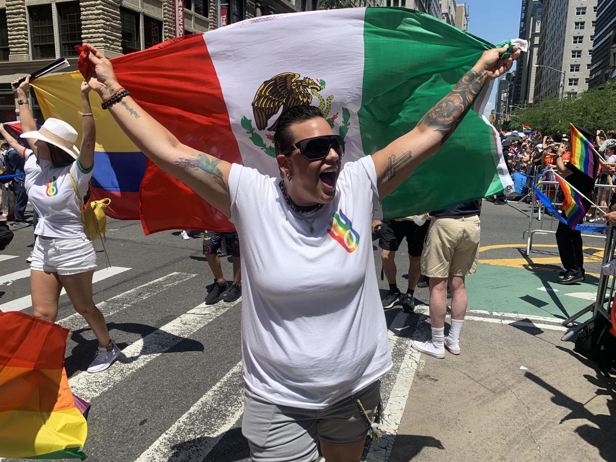 Participants walk in the Pride March in Manhattan on Sunday.