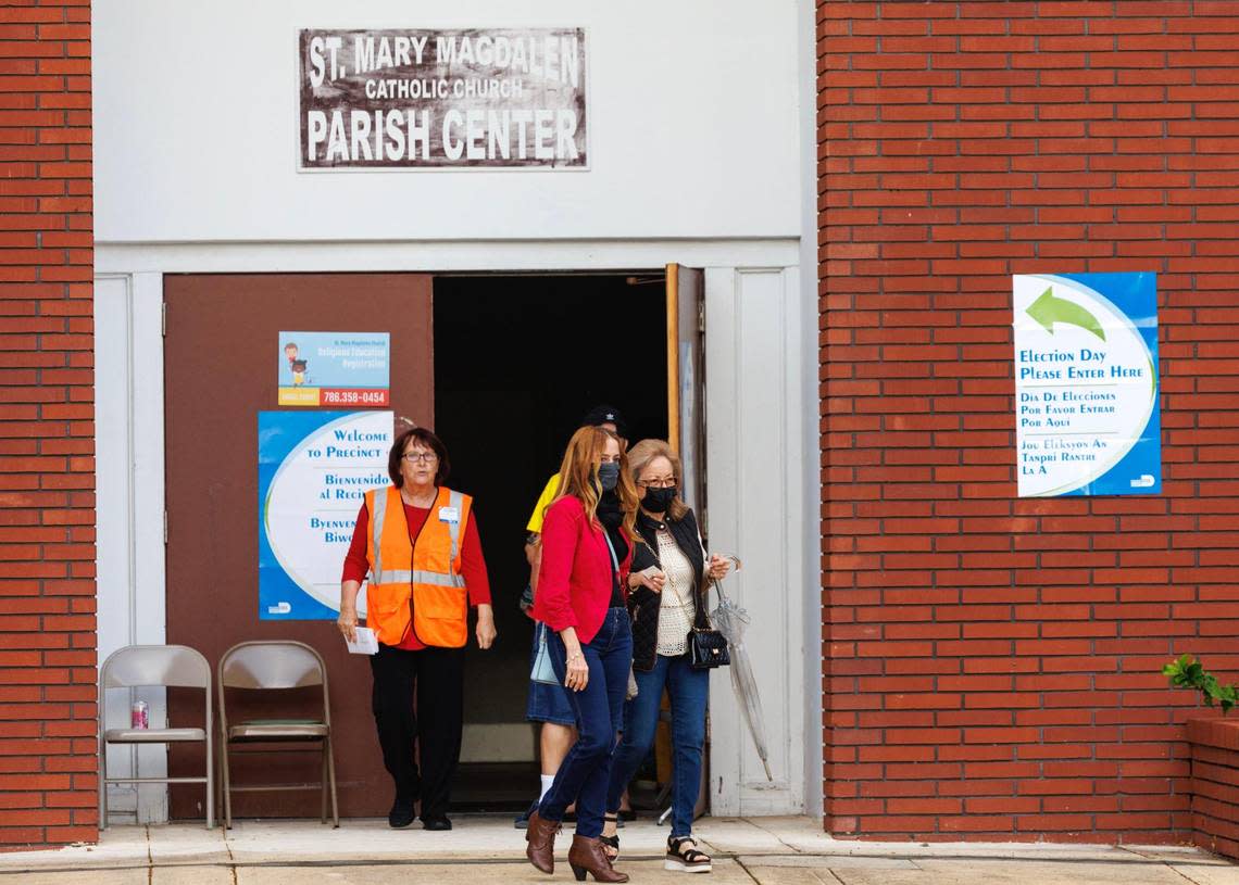 A poll worker and voters after they cast their ballots during the midterm elections in Miami-Dade County at the St. Mary Magdalen Church on Tuesday, Nov. 8, 2022, in Sunny Isles Beach, Florida.