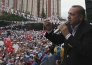 <p>Turkish Prime Minister Recep Tayyip Erdogan addresses the supporters of his Islamic-rooted Justice and Development Party during an election rally in Ankara on May 29, 2011. (AP Photo/Burhan Ozbilici) </p>