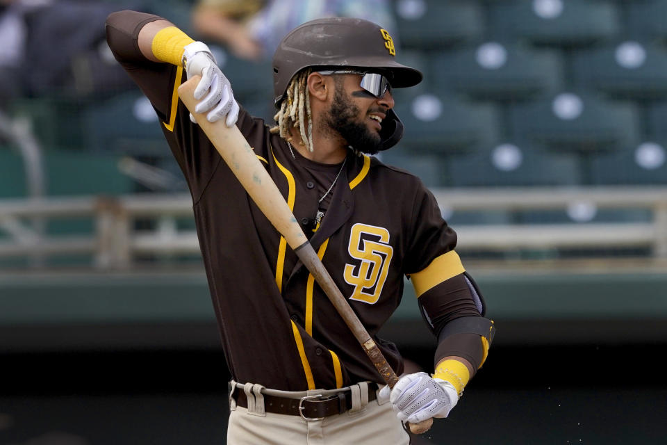 San Diego Padres' Fernando Tatis Jr. stretches in the batter's box during the first inning of a spring training baseball game against the Oakland Athletics, Friday, March 12, 2021, in Mesa, Ariz. (AP Photo/Matt York)