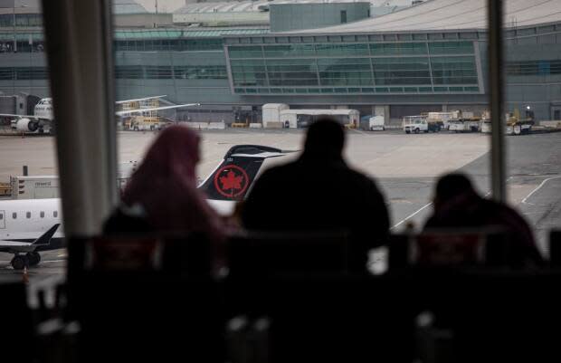 Toronto registered nurse Jessica Faraone appeared maskless at Toronto's Pearson airport after coming back from an international trip. She refused to take a COVID-19 test and\ to quarantine in a hotel — actions the Public Health Agency of Canada says could lead to a fine of up to $750,000 or six months in jail. (Evan Mitsui/CBC - image credit)