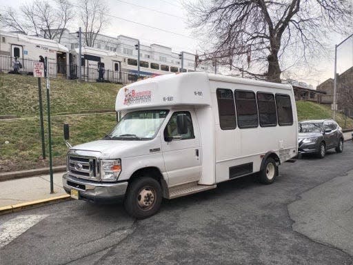 A Bloomfield Township shuttle bus parked near the train station.