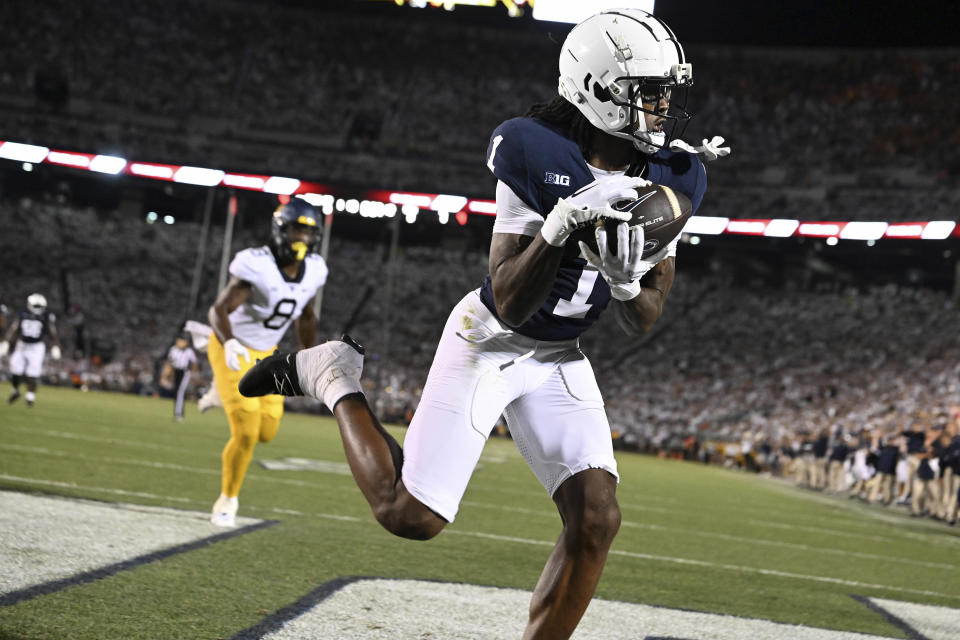 Penn State wide receiver KeAndre Lambert-Smith (1) catches a touchdown pass during the second half of an NCAA college football game against West Virginia, Saturday, Sept. 2, 2023, in State College, Pa. (AP Photo/Barry Reeger)