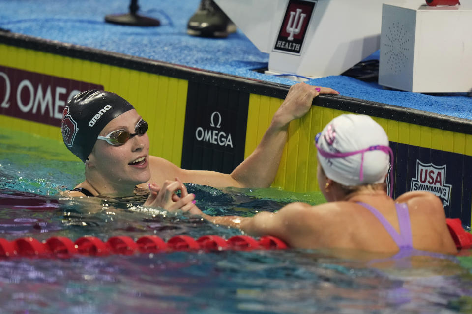 Katharine Berfkoff, left, is congratulated by Regan Smith after winning the women's 50-meter backstroke event at the U.S. nationals swimming meet in Indianapolis, Thursday, June 29, 2023. (AP Photo/Michael Conroy)