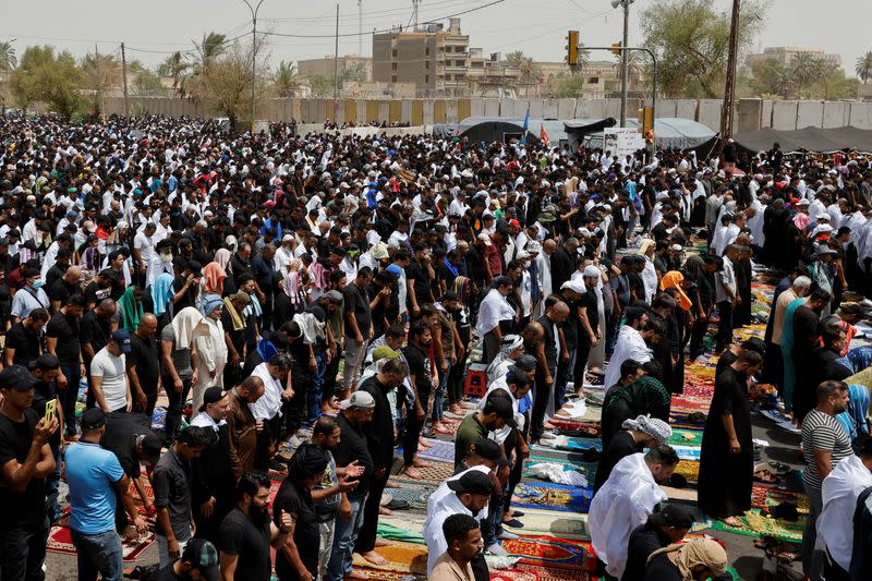 Supporters of Iraqi populist leader Moqtada al-Sadr gather for mass Friday prayer in front of parliament, in Baghdad