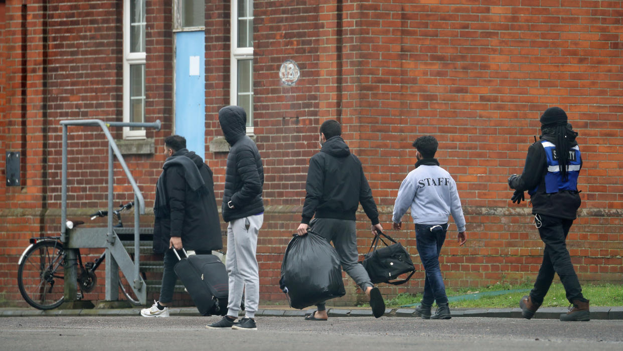 Two men leave Napier Barracks in Folkestone, Kent, which is currently being used by the government to house people seeking asylum in the UK. Friday. Picture date: Thursday February 4, 2021. (Photo by Gareth Fuller/PA Images via Getty Images)