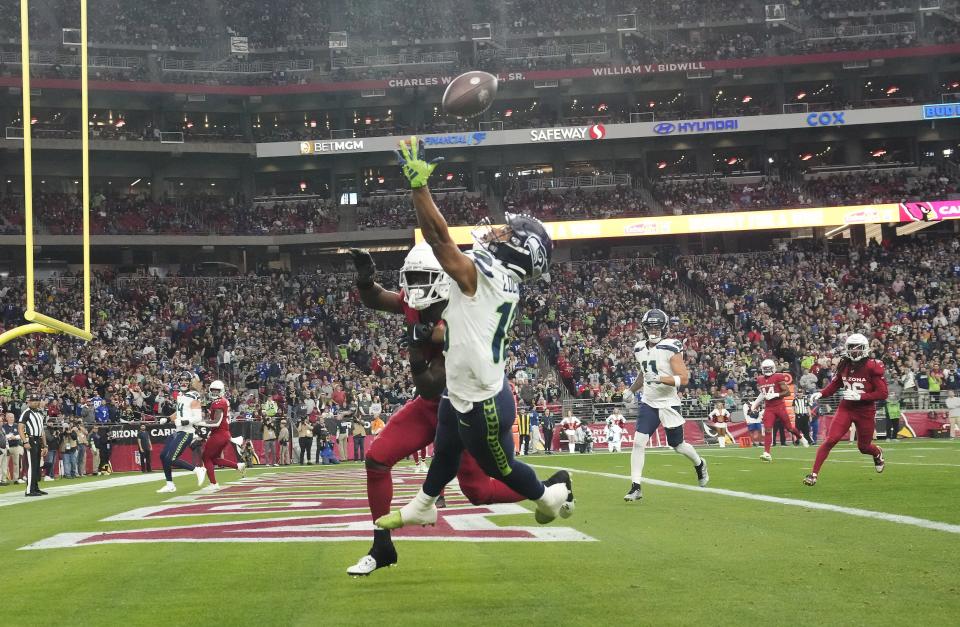 Arizona Cardinals cornerback Starling Thomas V (24) defends a pass intended for Seattle Seahawks wide receiver Tyler Lockett (16) during the second quarter at State Farm Stadium in Glendale on Jan. 7, 2024.