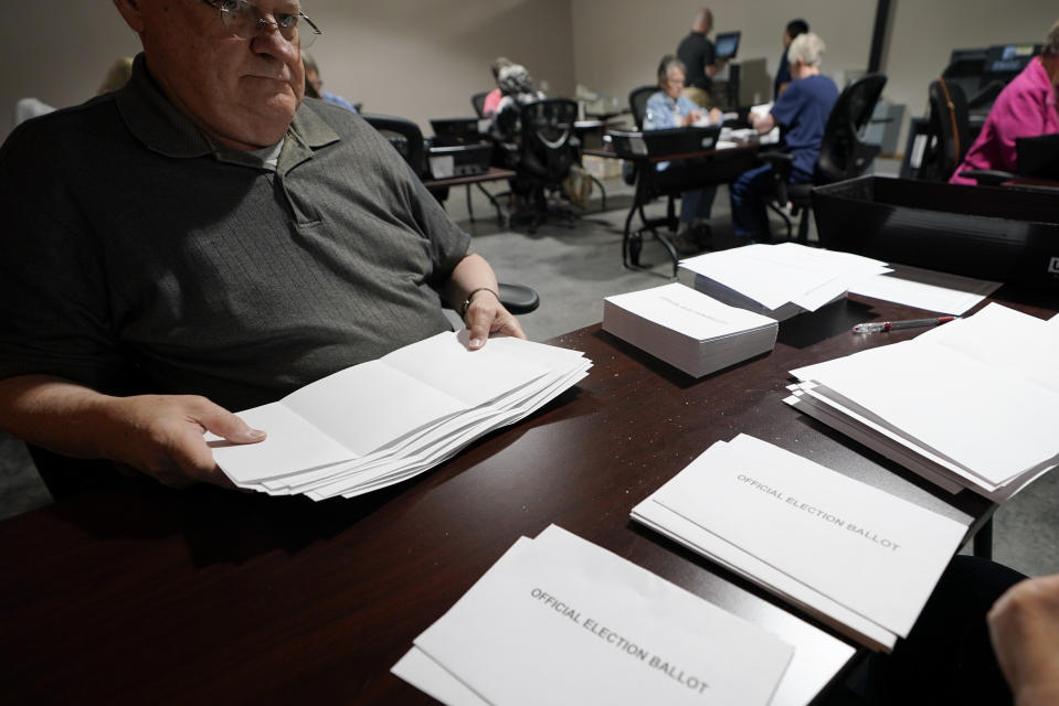 Election workers continue the process of counting ballots for the Pennsylvania primary election, Wednesday, May 18, 2022, at the Mercer County Elections Board in Mercer, Pa. Vote counting continues as Republican candidates Dr. Mehmet Oz and David McCormick are locked in a too-early-to-call race for Pennsylvania's hotly contested Republican nomination for an open U.S. Senate seat. (AP Photo/Keith Srakocic)