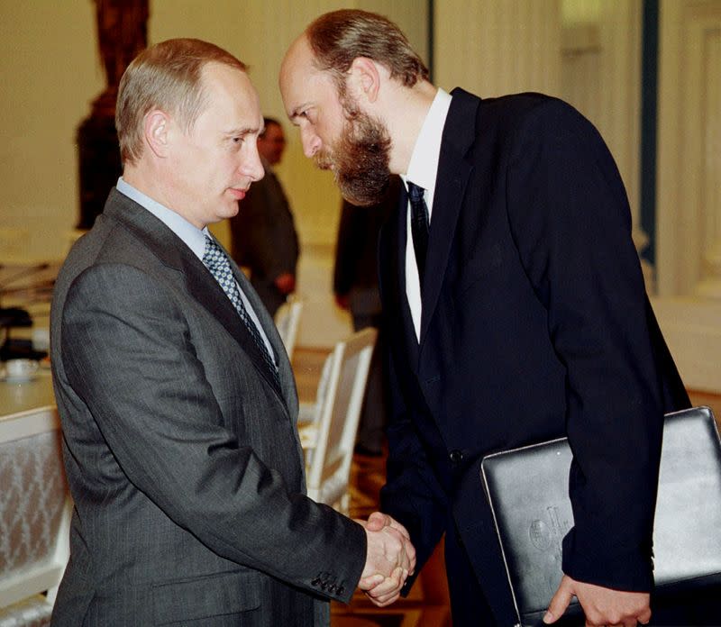 FILE PHOTO: Russian President Vladimir Putin speaks with Sergei Pugachev in Moscow