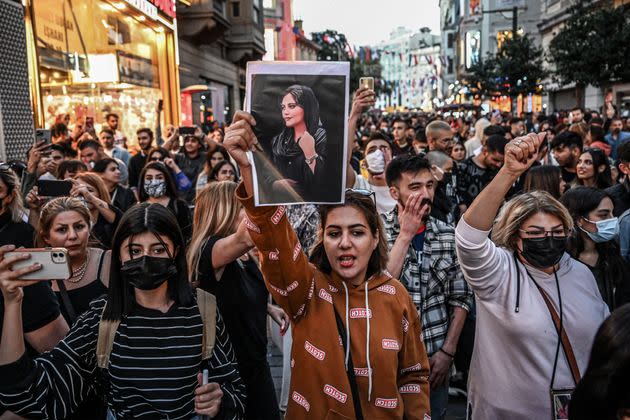 A protester holds a portrait of Mahsa Amini during a demonstration in support of Amini, who died after being arrested in Tehran by the Islamic Republic's morality police, on Istiklal Avenue in Istanbul on Sept. 20. (Photo: OZAN KOSE/AFP via Getty Images)