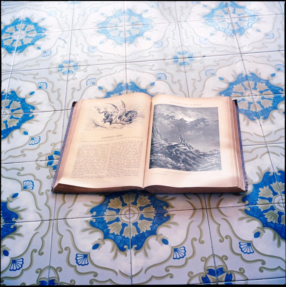 An antique copy of Cervantes’s Don Quixote—in Italian, of course—lies open on the maiolica-tiled floors. Said to have originated in Majorca, these tin-glazed pottery tiles have been typical of the region since the 15th century.