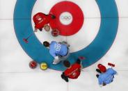 Curling - Pyeongchang 2018 Winter Olympics - Men's Round Robin - Britain v U.S. - Gangneung Curling Center - Gangneung, South Korea - February 21, 2018 - John Shuster, his teammate Tyler George of the U.S. and Britain's Thomas Muirhead and his teammate Cameron Smith in action. REUTERS/Phil Noble