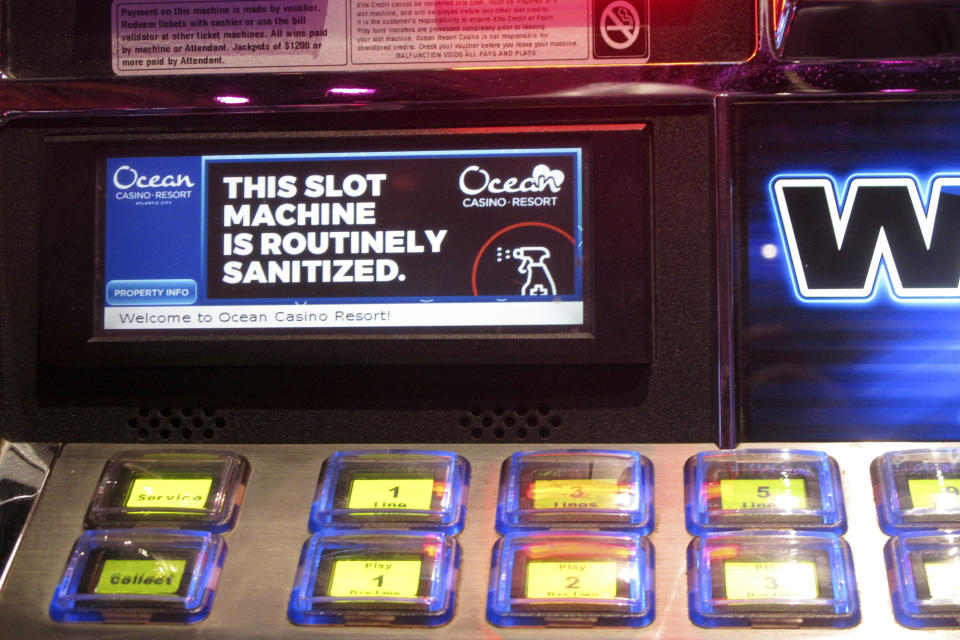 A slot machine at the Ocean Casino Resort in Atlantic City, N.J., indicating it will be routinely sanitized once the casino reopened a month later during the early stage of the COVID-19 outbreak, June 3, 2020. On Jan. 24, 2024, the New Jersey Supreme Court rejected an attempt by the casino to collect on a business interruption policy for the 3 1/2 months it was closed due to the pandemic. (AP Photo/Wayne Parry)