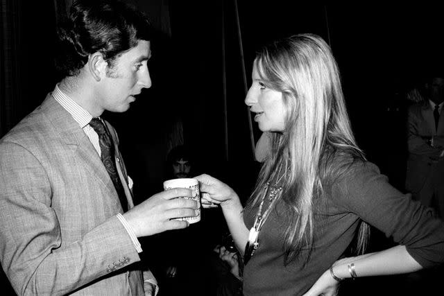 <p>Mark Sennet/Getty Images</p> Prince Charles and singer Barbra Streisand share a moment over coffee at Warner Bros. studio on March 19, 1974 in Los Angeles, California