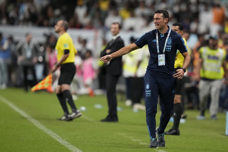 Argentina's head coach Lionel Scaloni, front. Watches the game during a friendly soccer match between Argentina and United Arab Emirates in Abu Dhabi, Wednesday, Nov. 16, 2022. (AP Photo/Kamran Jebreili)