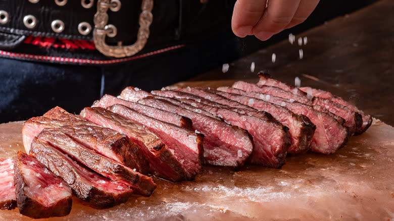 Salting medium rare sliced wagyu