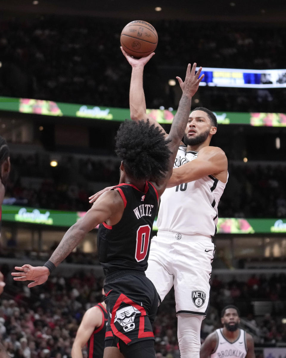 Brooklyn Nets' Ben Simmons, right, shoots over Chicago Bulls' Coby White (0) during the second half of an NBA in-season tournament basketball game Friday, Nov. 3, 2023, in Chicago. (AP Photo/Charles Rex Arbogast)