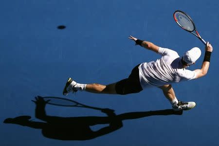 Tennis - Australian Open - Melbourne Park, Melbourne, Australia - 16/1/17 Britain's Andy Murray casts a shadow as he hits a shot during his Men's singles first round match against Ukraine's Illya Marchenko. REUTERS/Thomas Peter