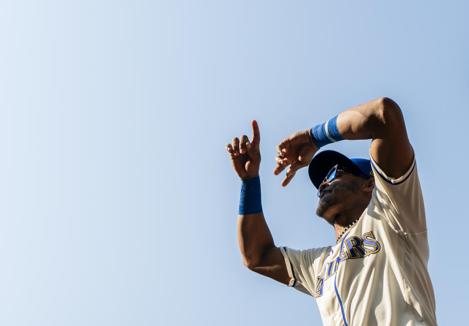 Seattle Mariners center fielder Julio Rodriguez gestures to fans after a 3-2 win over the Kansas City Royals in a baseball game, Sunday, Aug. 27, 2023, in Seattle. (AP Photo/Lindsey Wasson)