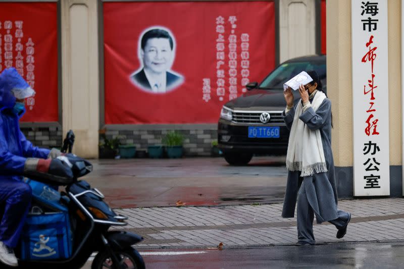 Pictures of Chinese President Xi Jinping overlook a street ahead of the National People's Congress (NPC), in Shanghai