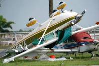 <p>A plane is overturned at North Perry Airport in Pembroke Pines, Florida, following high winds in the area on Sept. 28.</p>